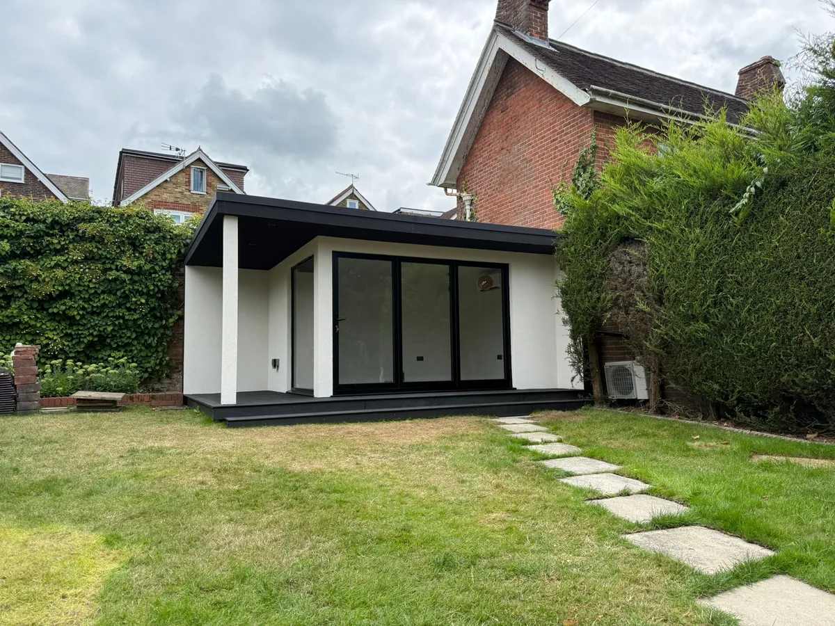 Modern rendered SIP garden room exterior — front view, Surrey