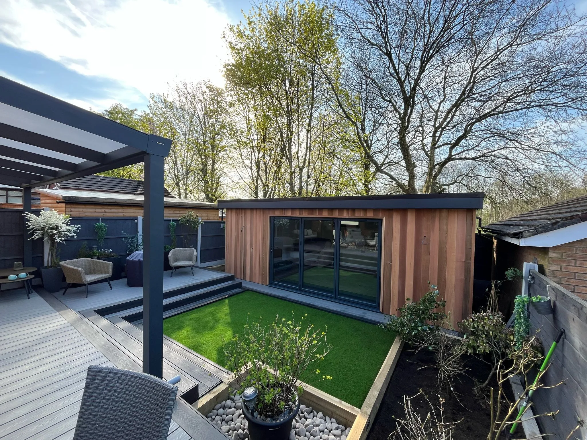 Cedar garden room with composite decking and pergola