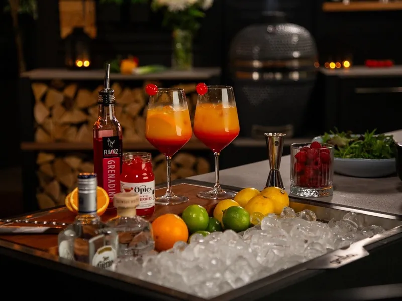 Cocktails and fresh ingredients prepared on a Grillo outdoor kitchen worktop