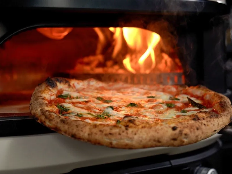 Wood-fired margherita pizza cooked in a Grillo outdoor pizza oven