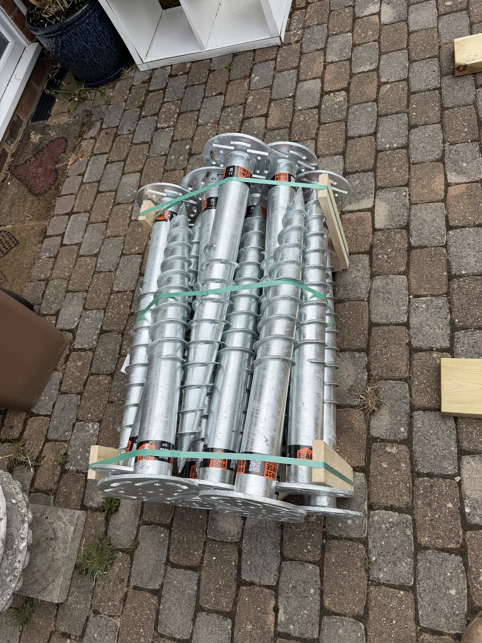 Pallet of galvanised First Base ground screws strapped and delivered to site ready for installation
