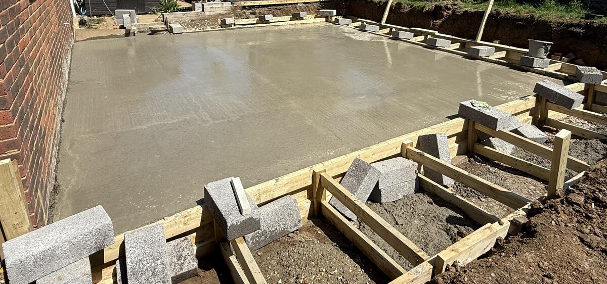Concrete slab pour for garden room foundation in Surrey