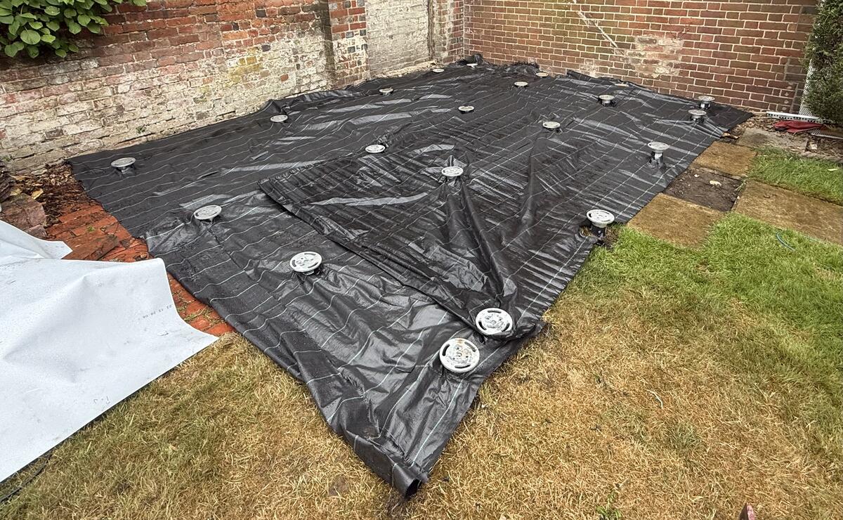 Ground screws installed for a garden room foundation in Surrey