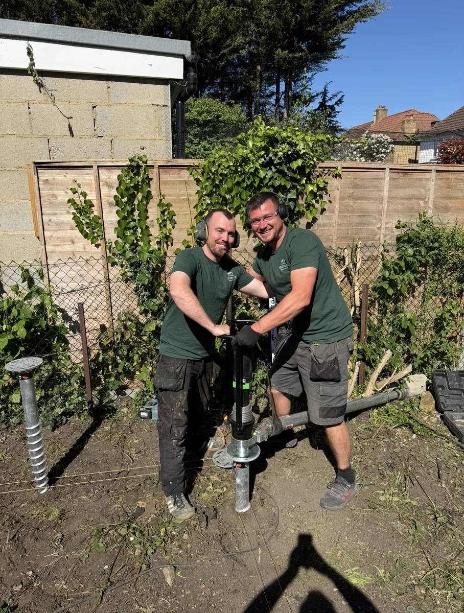 Henry Helps and team installing ground screw foundations for a garden room in Surrey