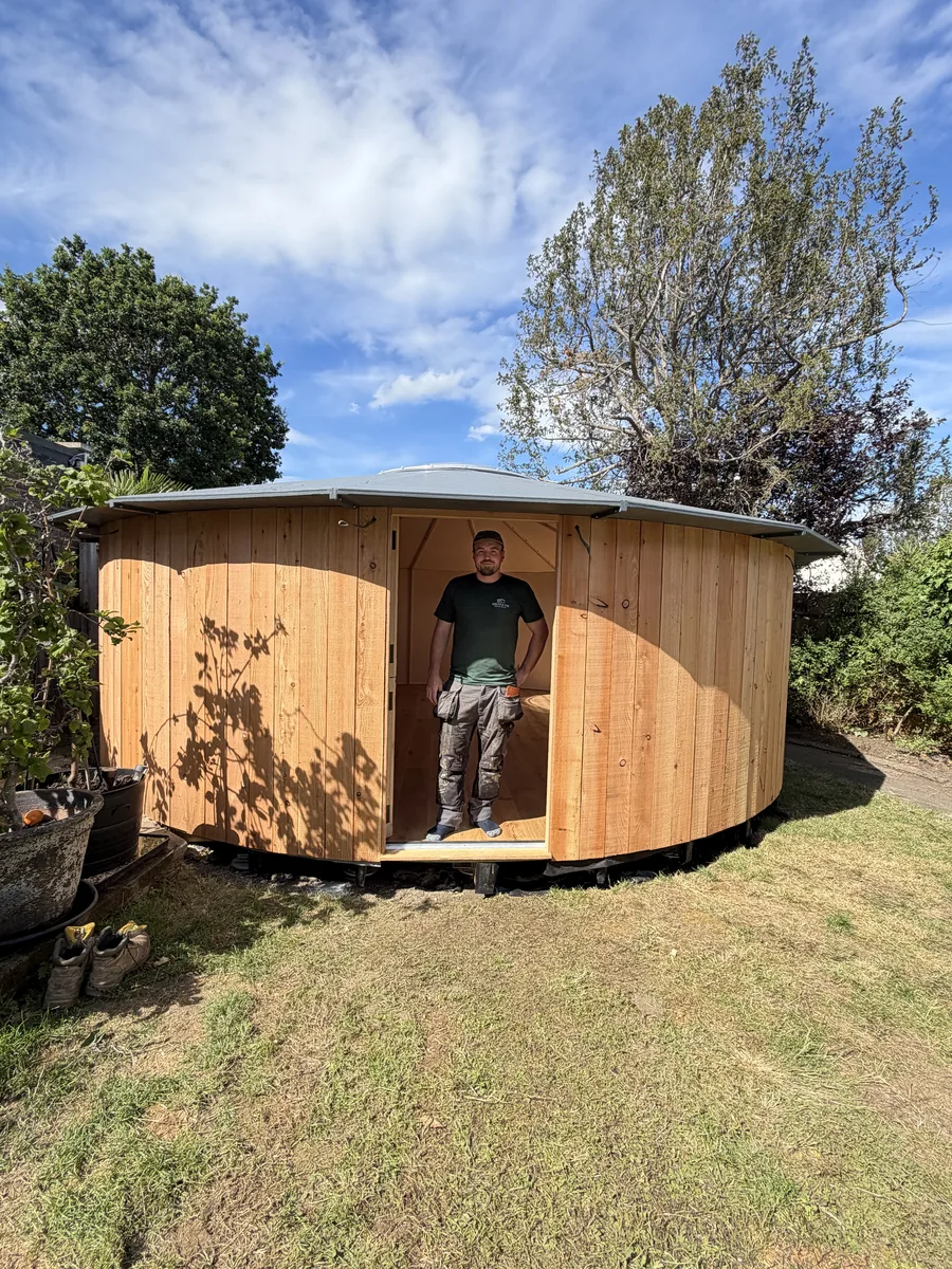 Bespoke circular timber garden building handcrafted by Helps & Co in Surrey